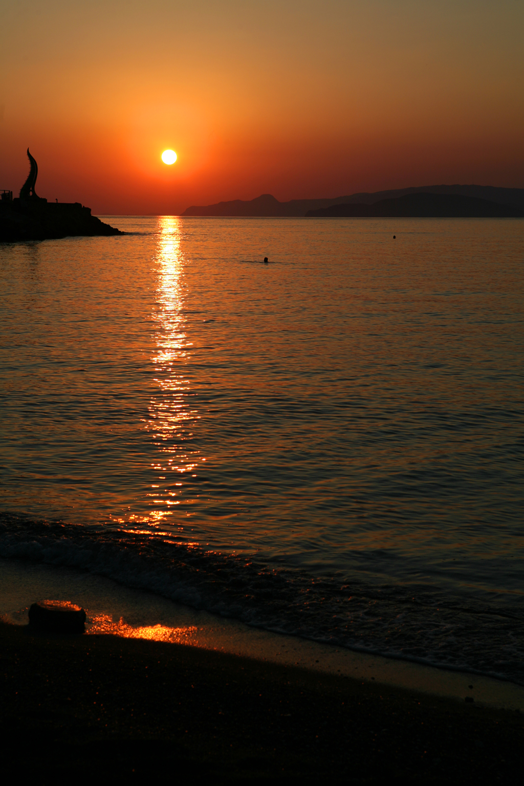 dreamstime_3100374_Sunrise over Aghios Nikolaos resort in Crete, Greece